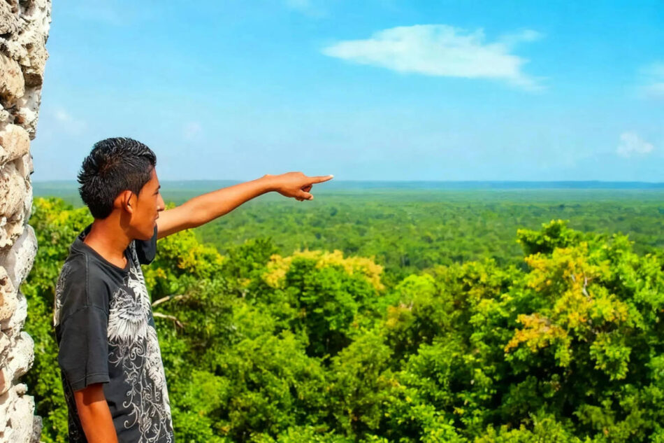 Germán pointing toward Chetumal on the horizon.