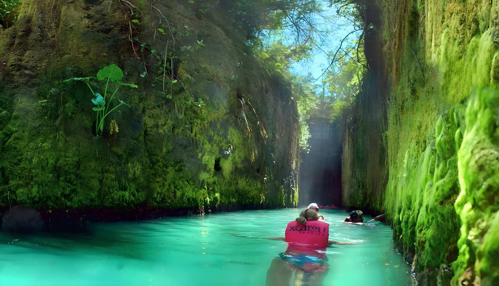 Subterranean river. People floating with vests.